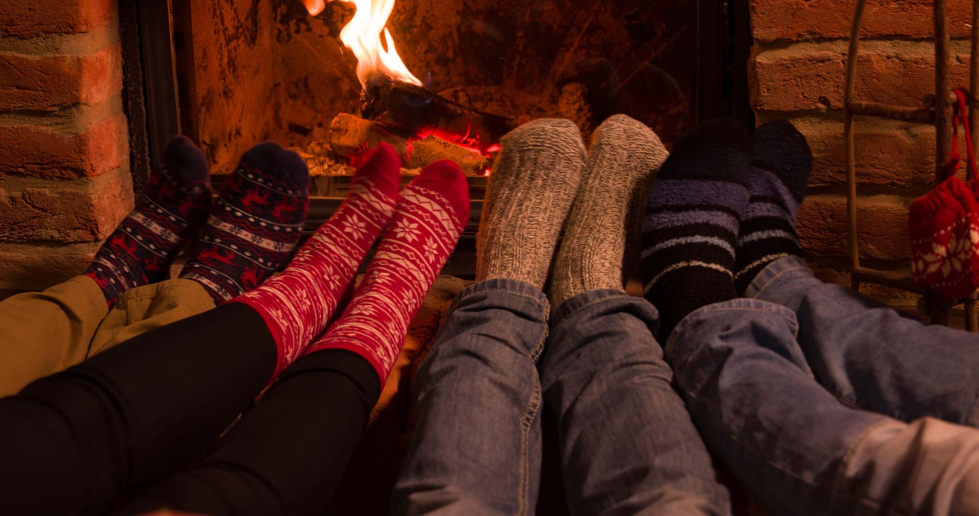winter safety in the home - feet warming by a fire